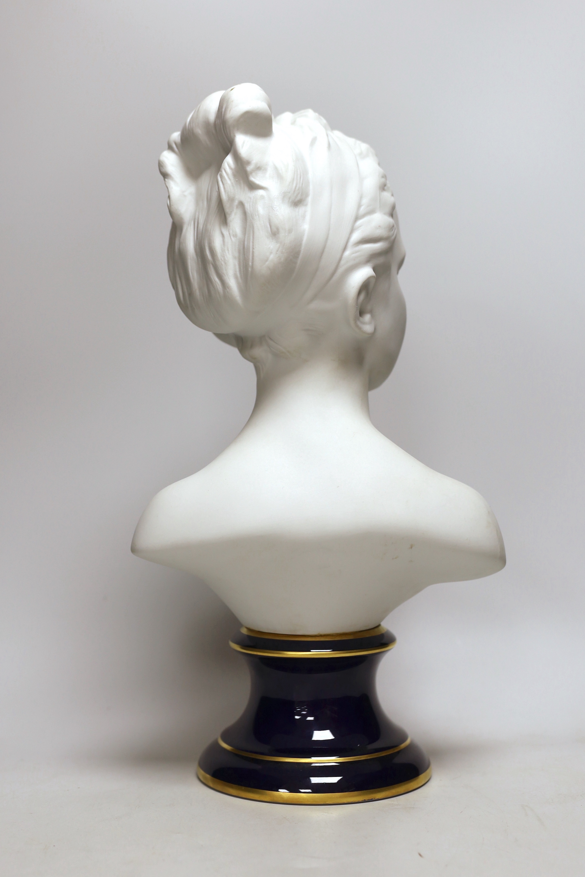 Tharaud Limoges France, a biscuit porcelain bust of a girl, 40cm